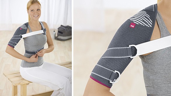Omomed Schulterimmobilisationsbandagen Frau auf Bank -